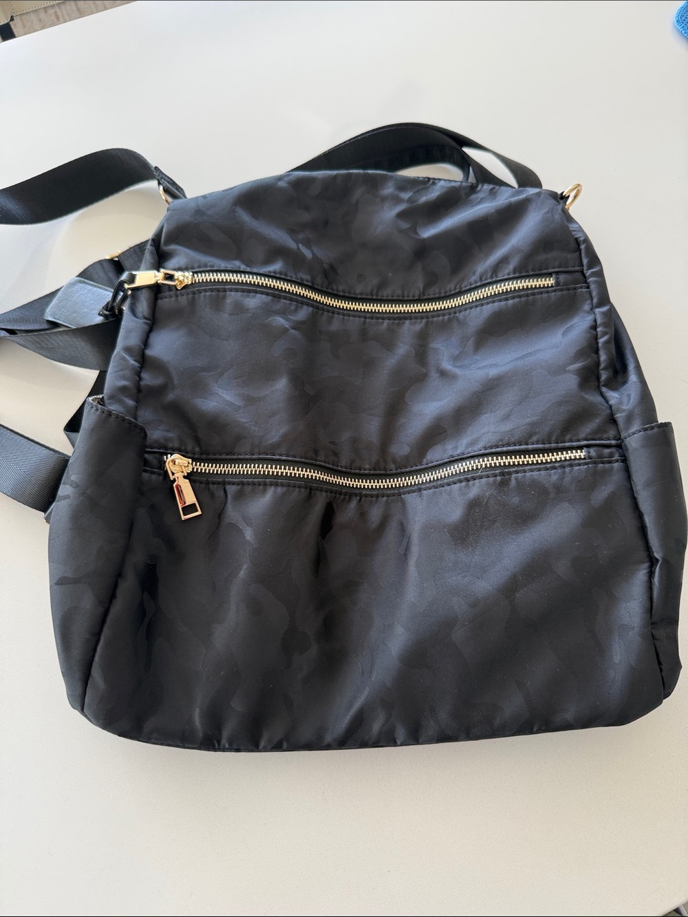 Black Nylon Backpack with Gold Zippers with slight camouflage detail